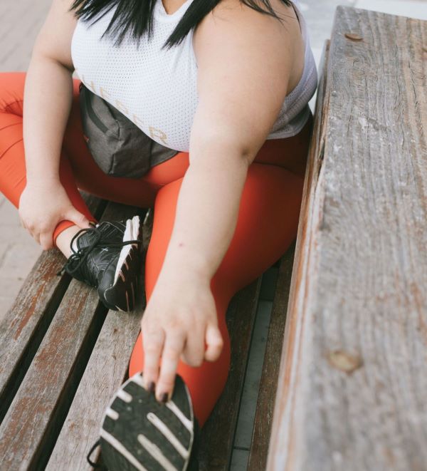 woman stretching before run