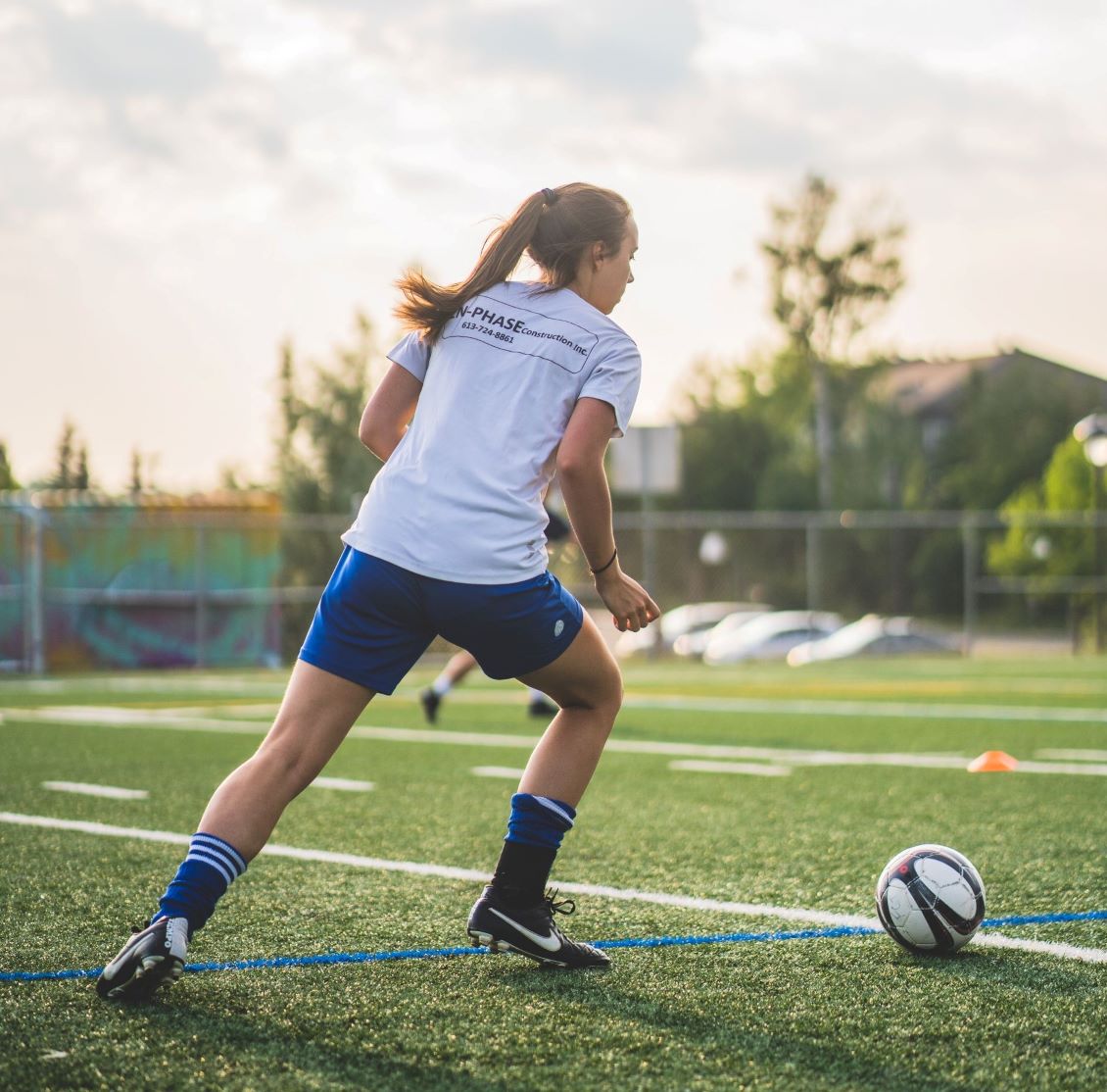 girl playing soccer