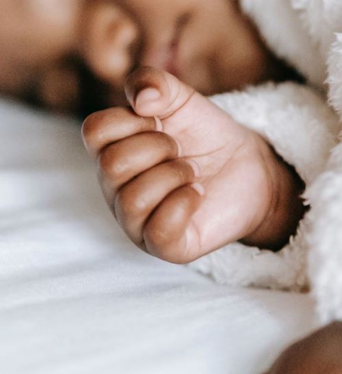 baby's hand in a fist