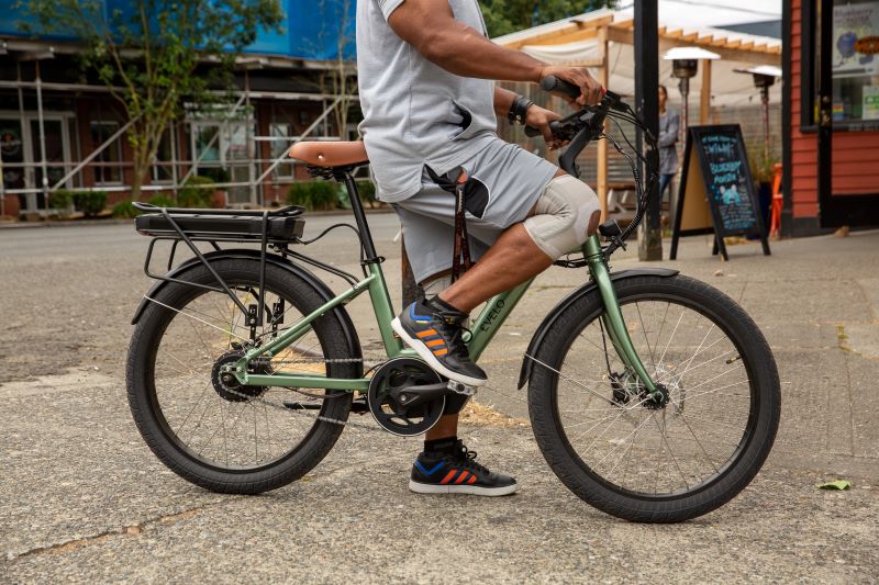 man on bike with knee brace