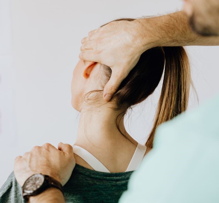 neck and shoulder stretch on woman
