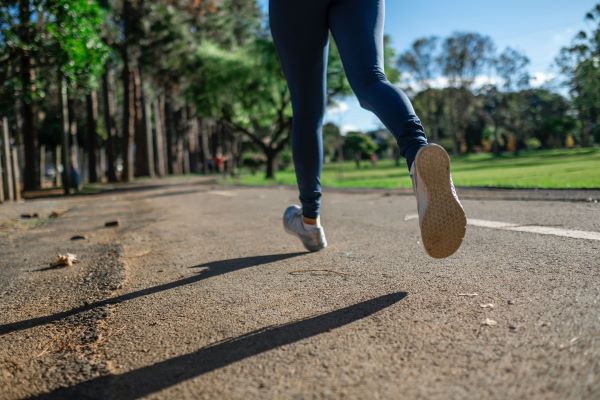 Person running down a road