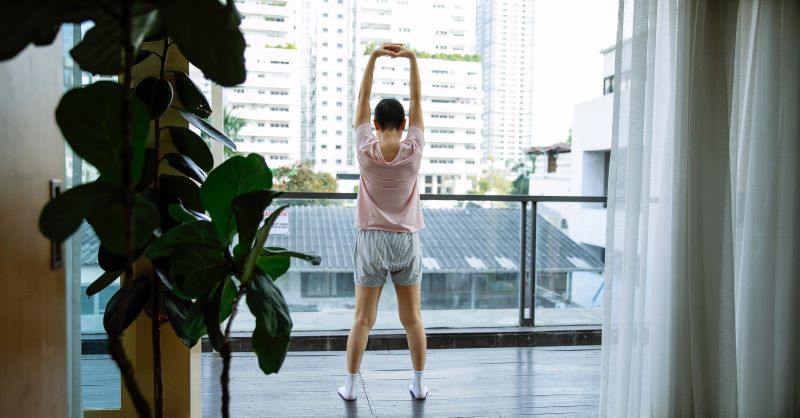 woman stretching shoulders
