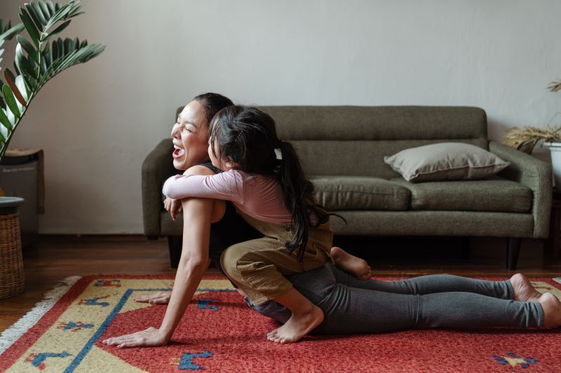 Woman stretching with child