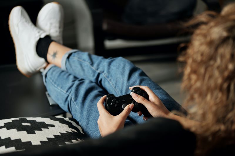 video game player with feet up